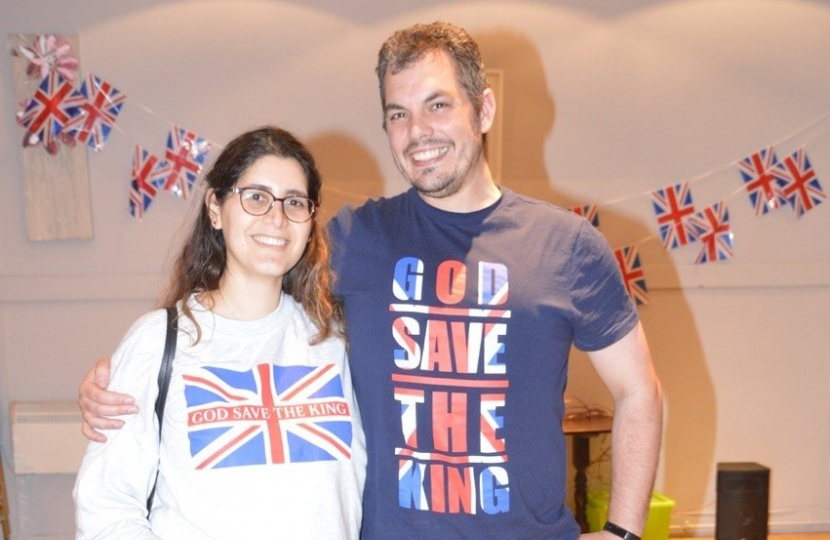Party members celebrate King Charle's Coronation in Union Jack T-shirts