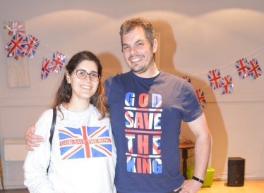 Party members celebrate King Charle's Coronation in Union Jack T-shirts